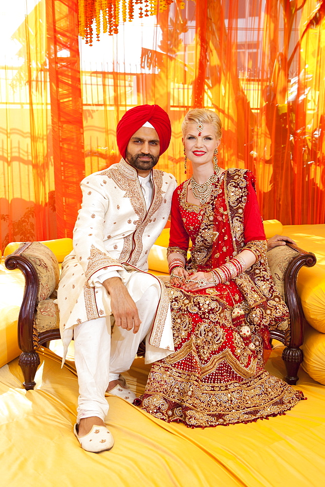 Portrait Of A Mixed Race Couple On Their Wedding Day In Traditional Indian Garments For A Wedding, Ludhiana, Punjab, India