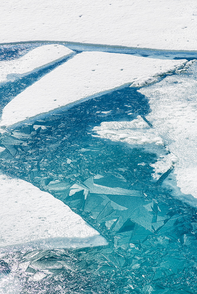 Ice Breaking Apart On The Surface Of Portage Lake In Springtime With Ice Crystals In The Water, Chugach National Forest, Portage, Alaska, United States Of America