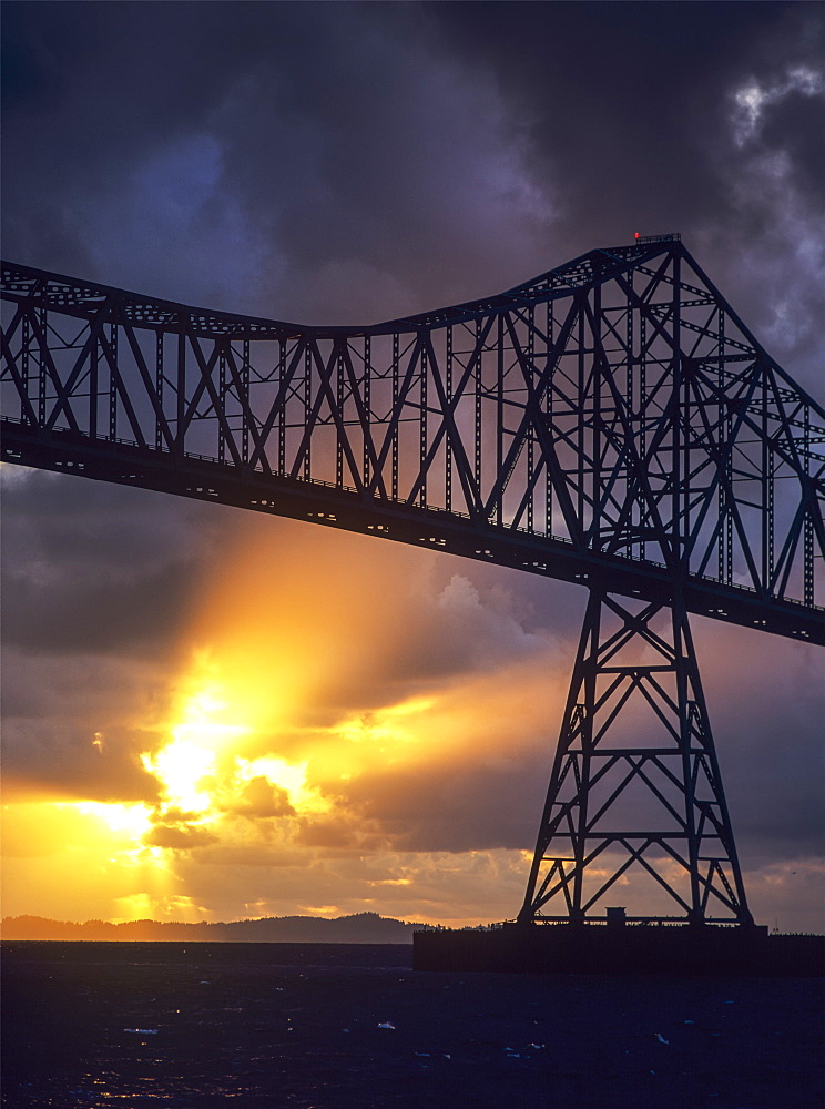 The Sun Sets Below The Astoria-Megler Bridge, Astoria, Oregon, United States Of America