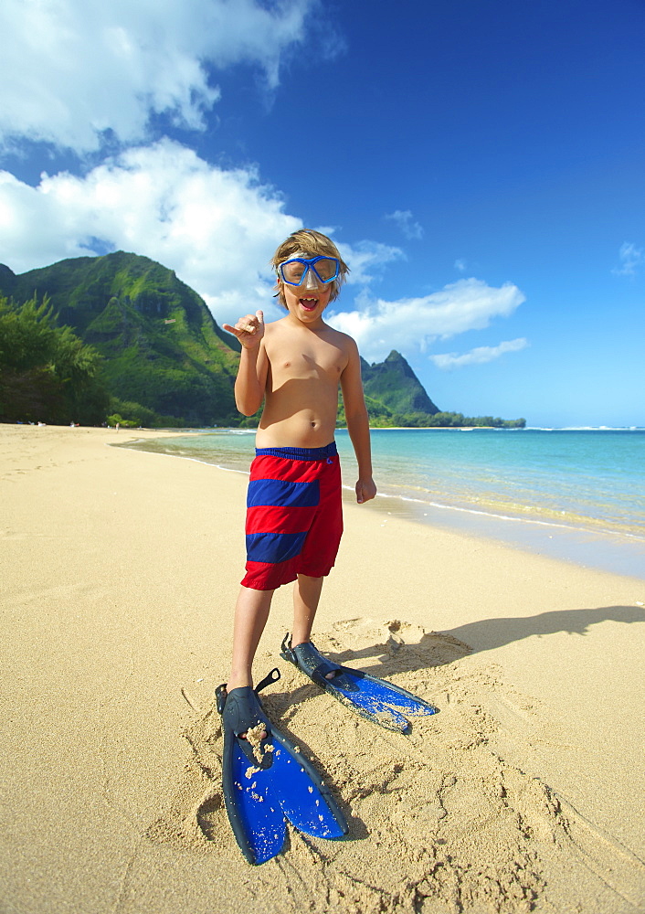 A Boy On The Beach With Snorkelling Gear, Kauai, Hawaii, United States Of America