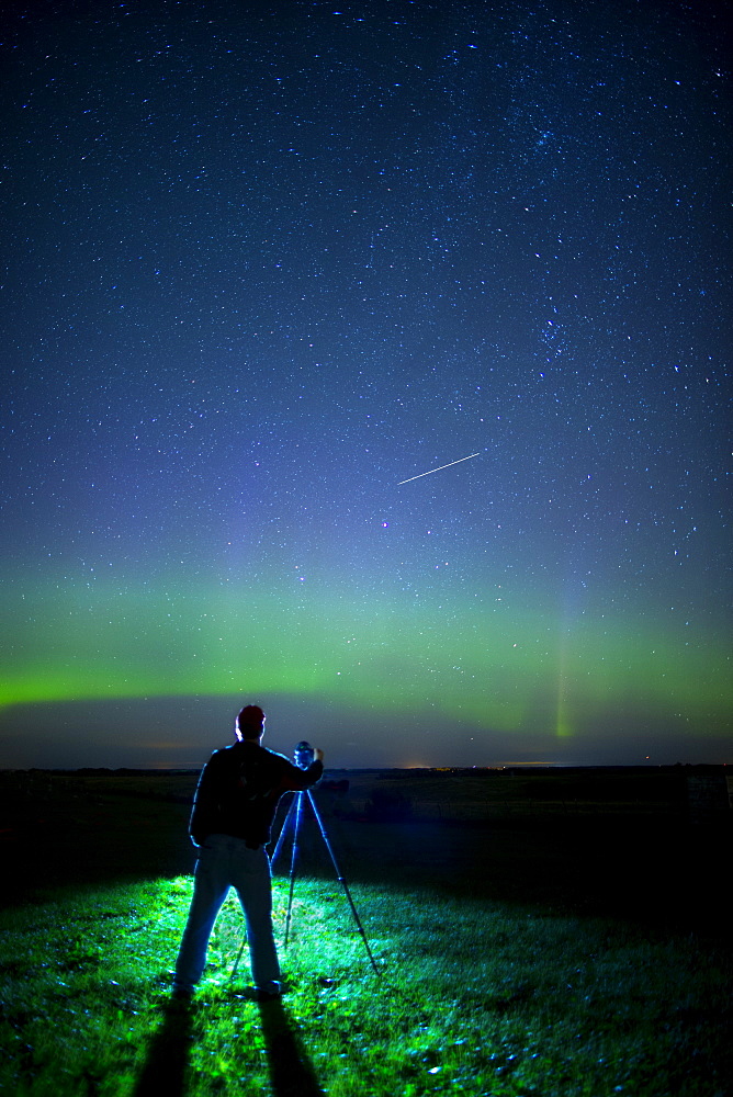 A Photographer Captures The Northern Lights And Shooting Star, Near Edmonton, Alberta Canada