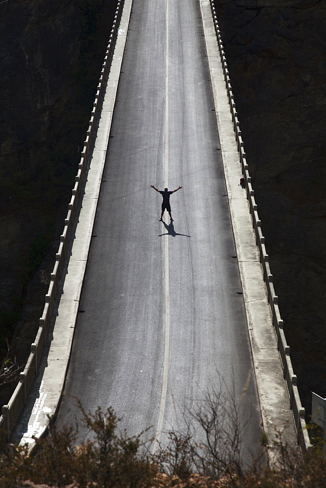 Silhouette Of Man On High Bridge, Lijiang, Yunnan Province, China