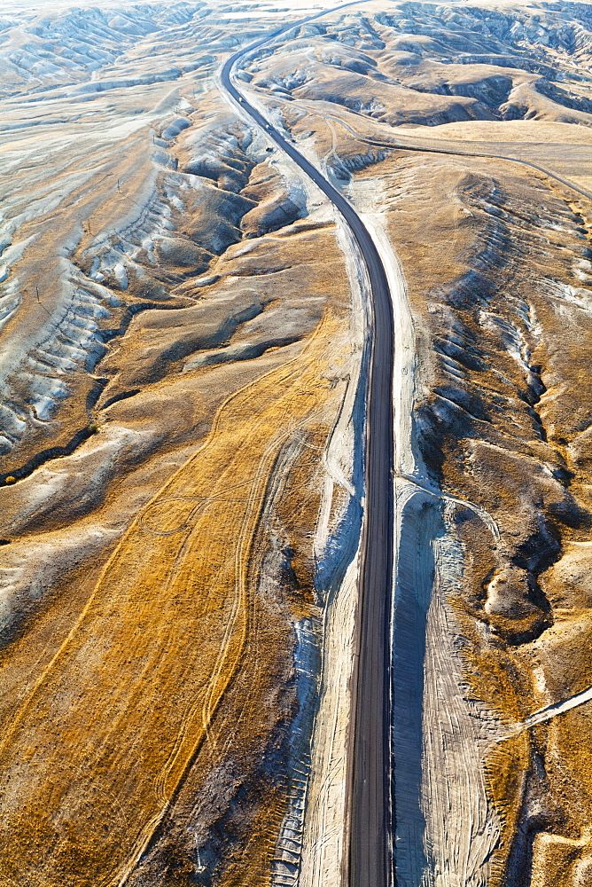 Aerial View Of A Road Through A Rugged, Barren Landscape, Cappadocia, Turkey