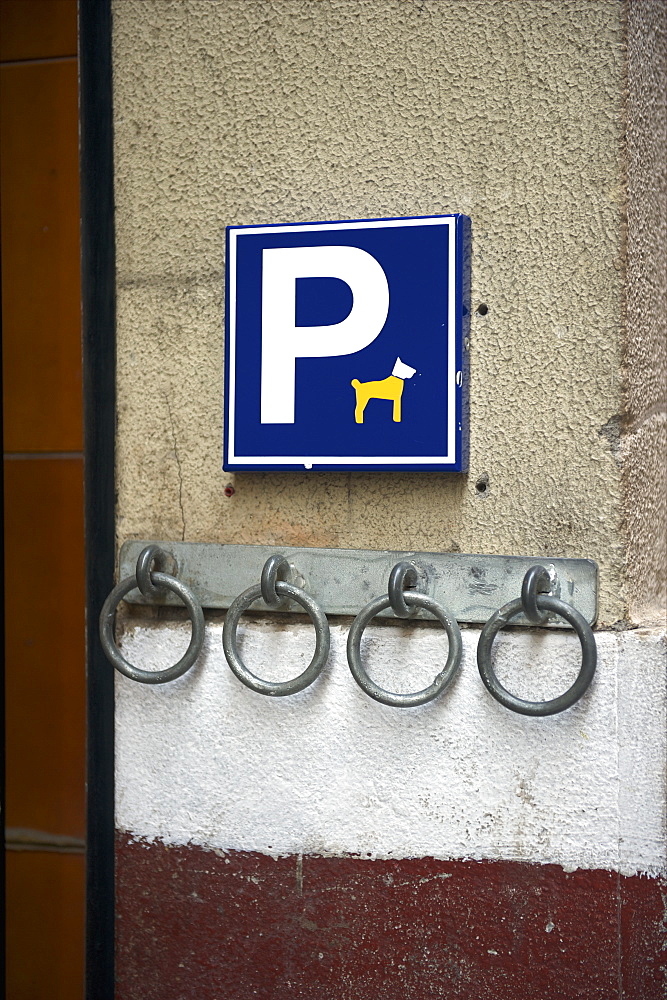 A Humorous Sign For Parking, Or Tethering, Your Pet To A Metal Ring On The Wall, Barcelona, Spain