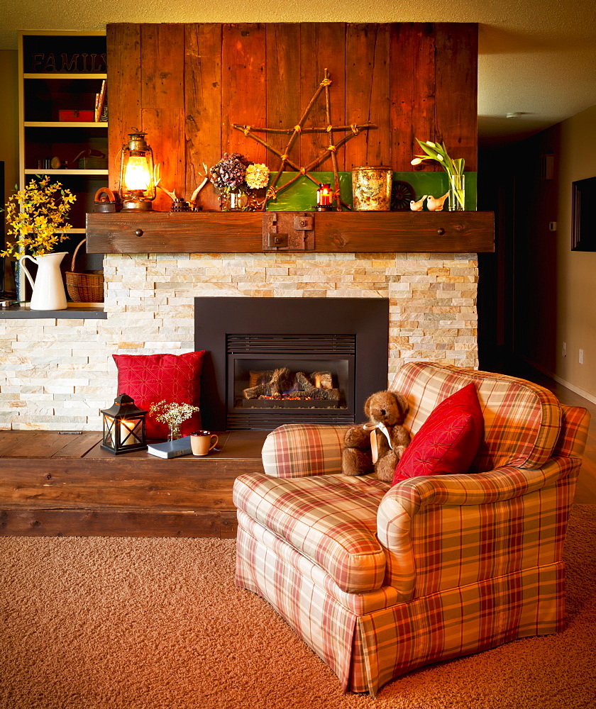 A Living Room Chair In Front Of The Fireplace, Yarrow, British Columbia, Canada