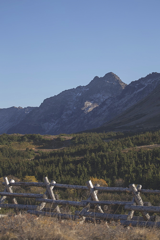 Scenic View Of Chugach Mountains With A Log Fence In The Foreground, Southcentral Alasak, Autumn