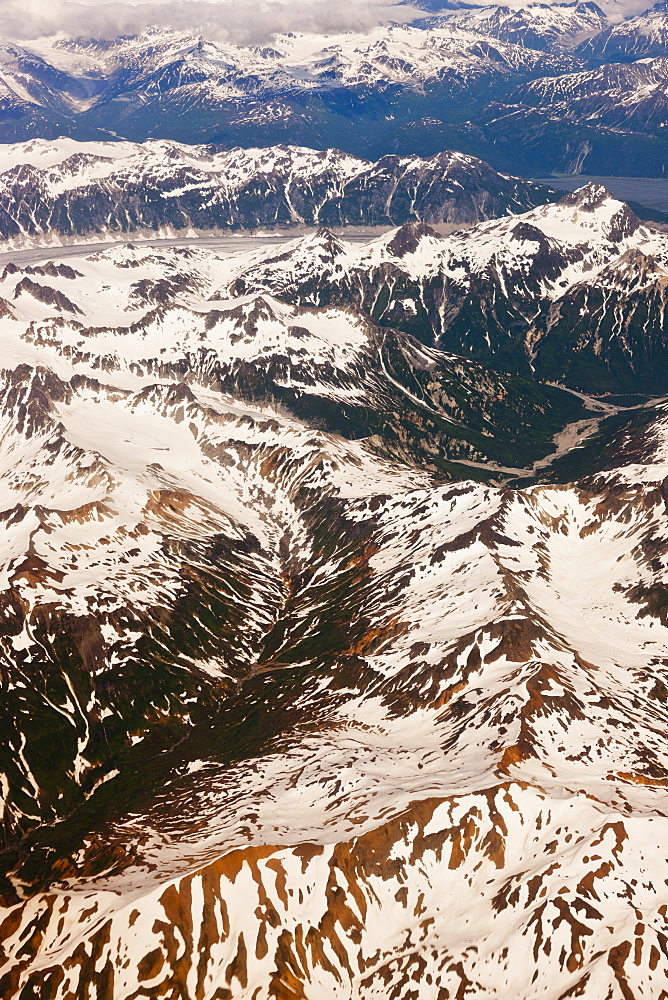 Aerial Perspective Of Glaciers, Fjords, And Snow-Covered Moutains In The Aleutian Range, Alaska Peninsula, Southwestern Alaska, USA, Summer