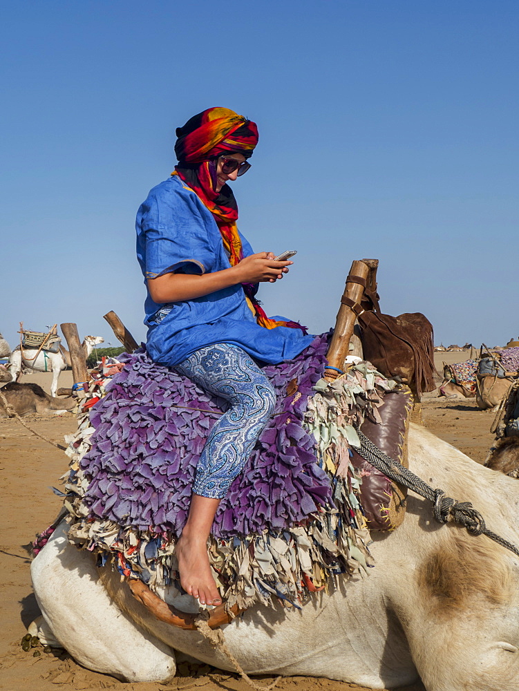 Tourist Ready For A Beach Camel Trek, Essaouira, Morocco