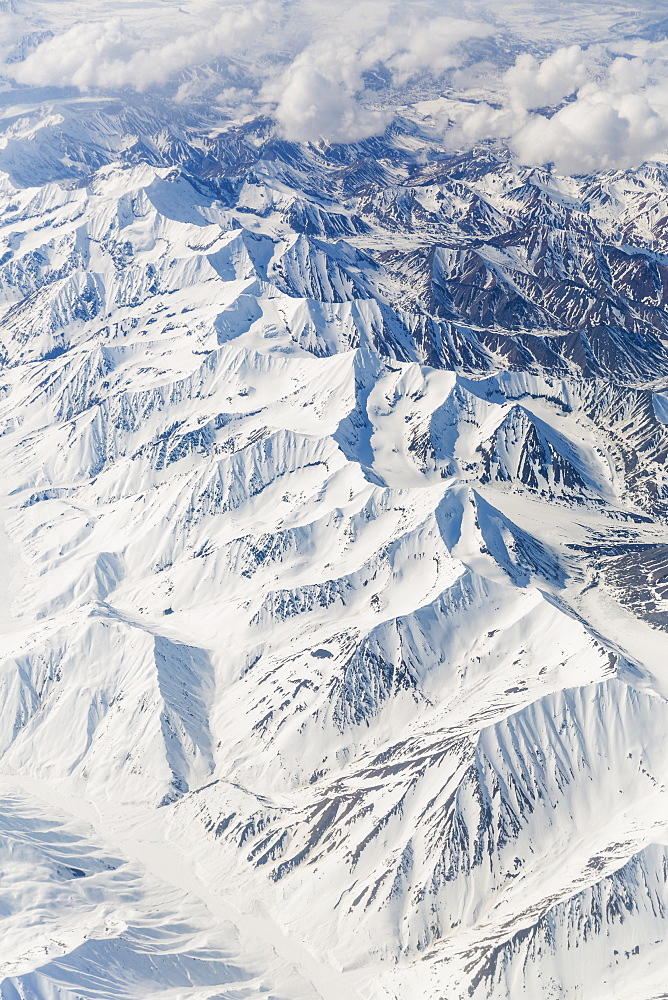 Aerial View Of Snow Covered Mountains In The Alaska Range, Interior Alaska, USA, Winter