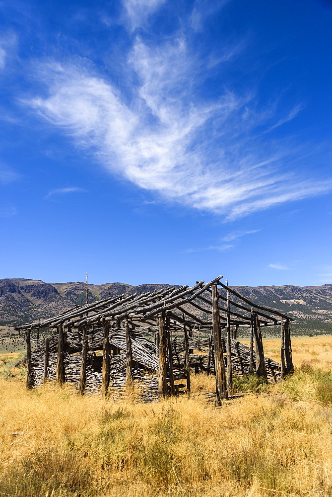 A Cloud Watches Over An Old Homestead, Fields, Oregon, United States Of America