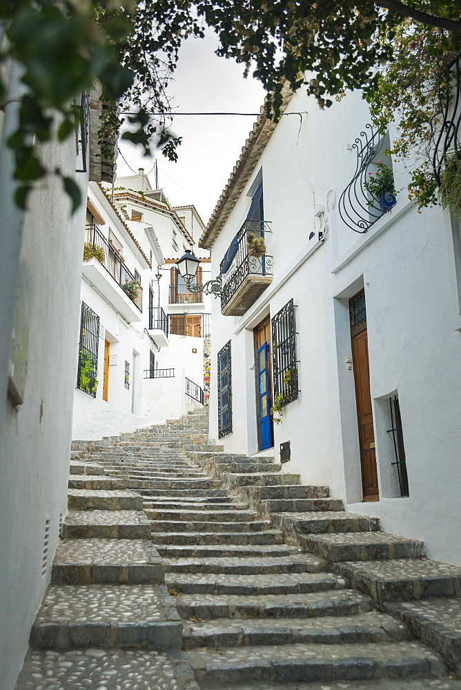 Steps Up A Sloped Street In The Beautiful Town Of Altea In Costa Blanca, Where The Houses Are Painted With The Typical Mediterranean Colours, White Walls And Blue Doors And Windows, Altea, Alicante, Spain