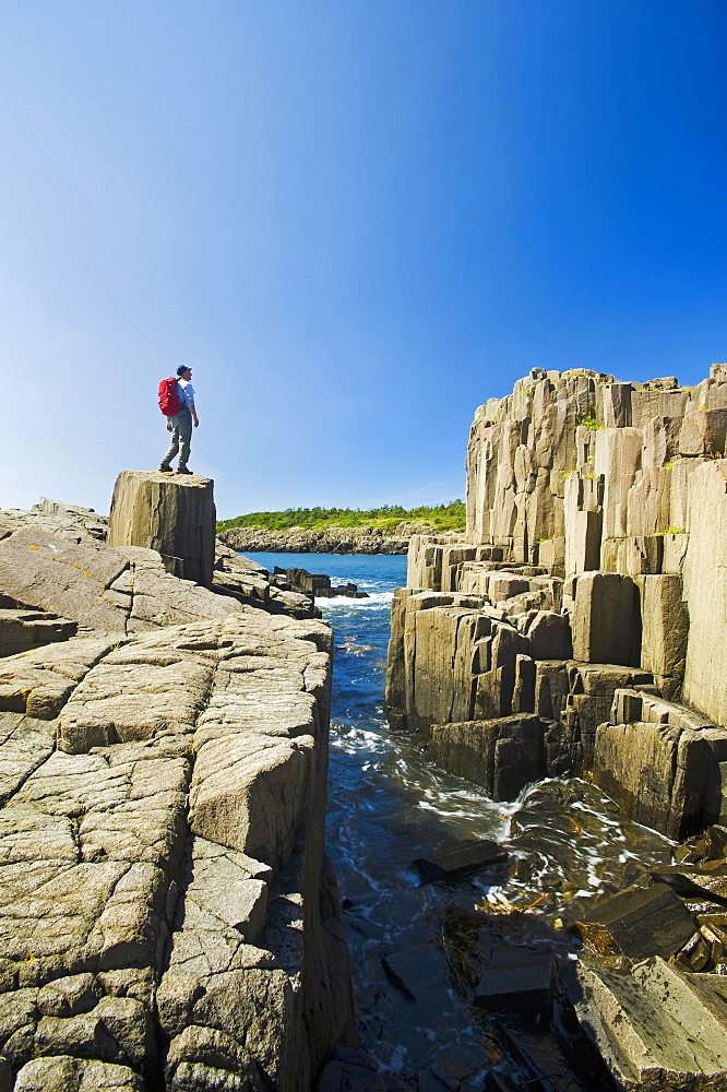 Hiker Along Basalt Rock Cliffs, Brier Island, Bay Of Fundy, Nova Scotia, Canada