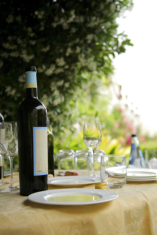 Tuscany, Italy; Table Set With Wine Glasses And Olive Oil