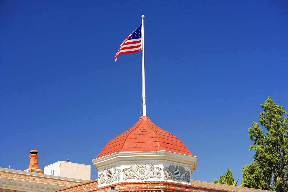 High section view of a building with an American flag on the top of it