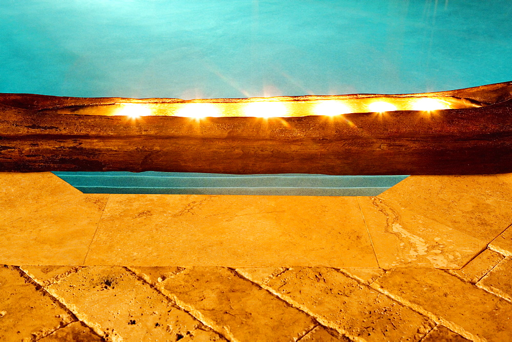 Close-up of electric lights at the poolside