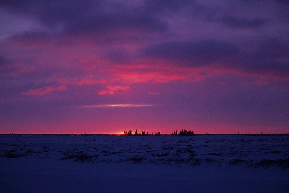 Sunset over a frozen landscape, Churchill, Manitoba, Canada