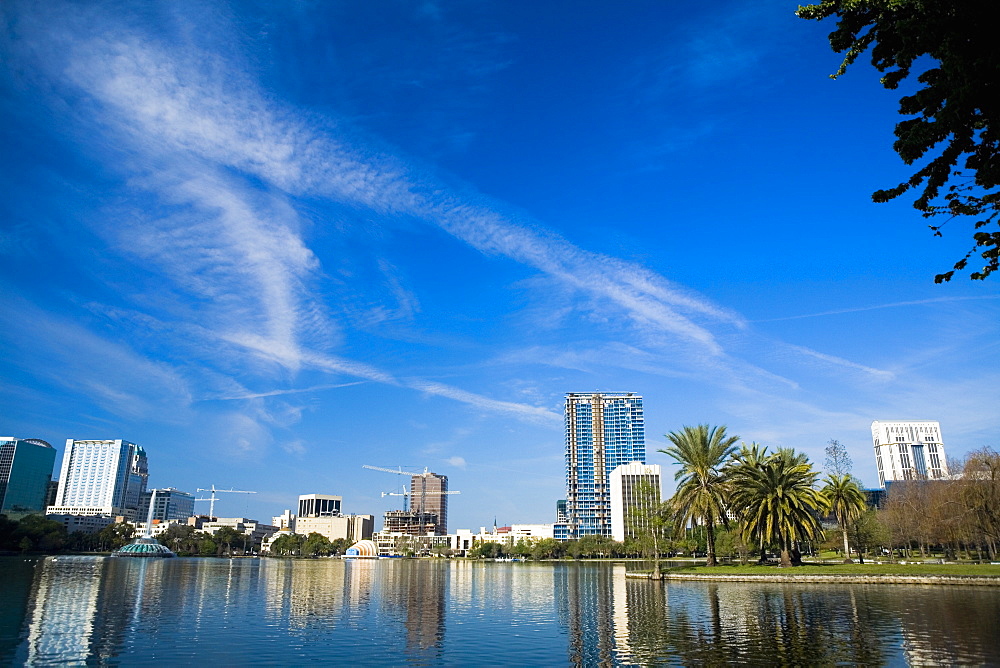 Reflection of buildings in water, Lake Eola, Orlando, Florida, USA