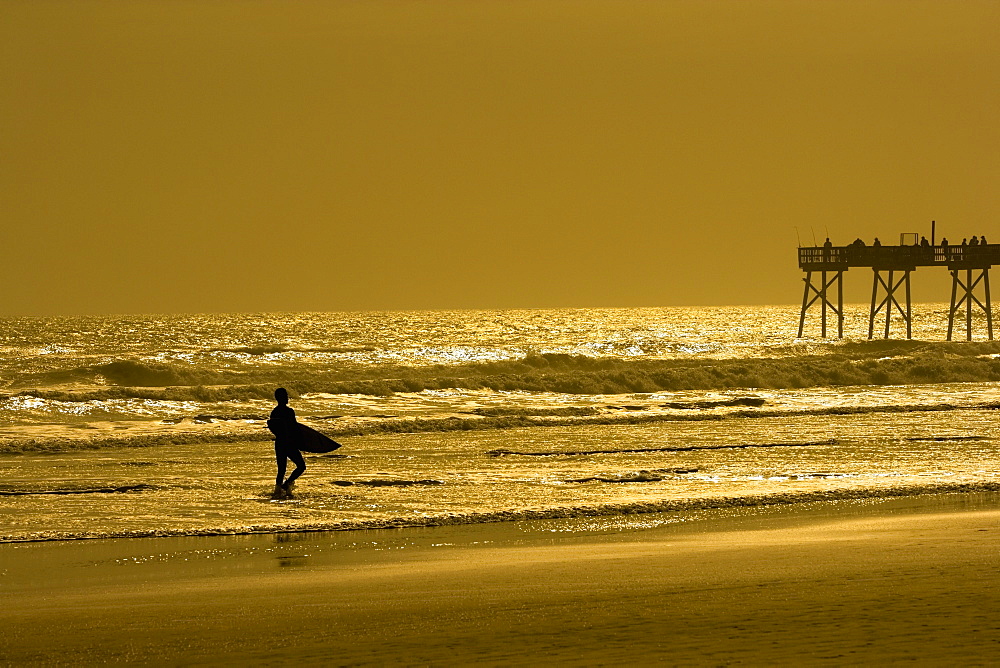 Silhouette of a person walking on the beach, Daytona Beach, Florida, USA