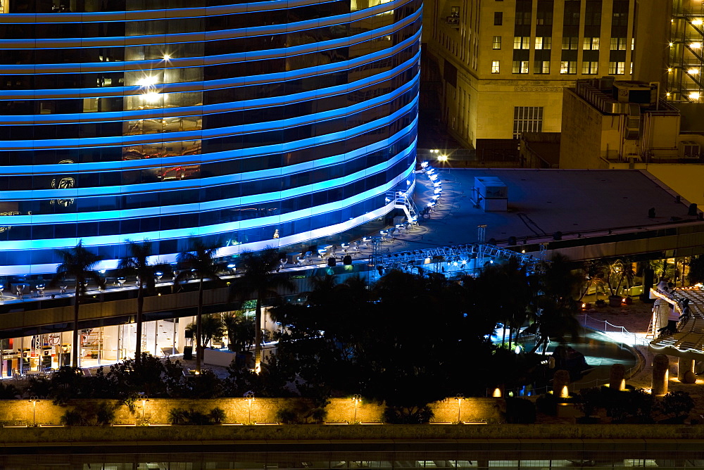 High angle view of buildings lit up at night