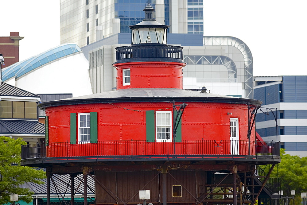 Lighthouse in front of buildings, Seven Foot Knoll Lighthouse, Inner Harbor, Baltimore, Maryland, USA