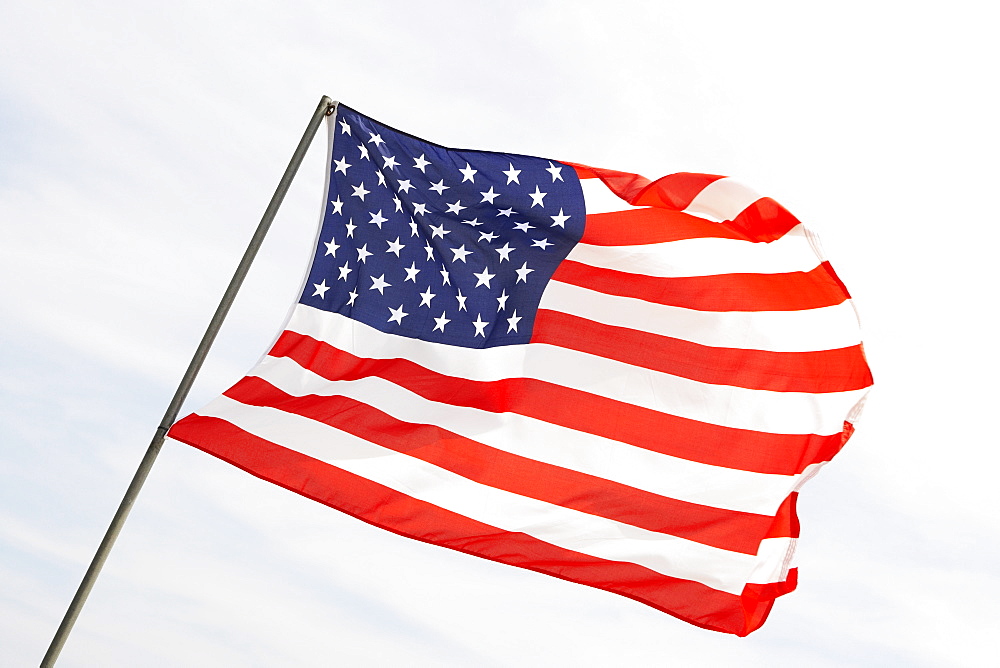 Low angle view of an American flag fluttering, USA