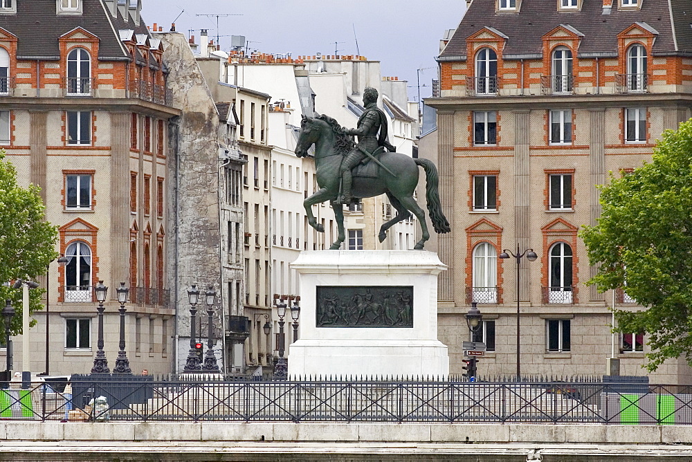 Statue of Henri IV in front of buildings, Paris, France