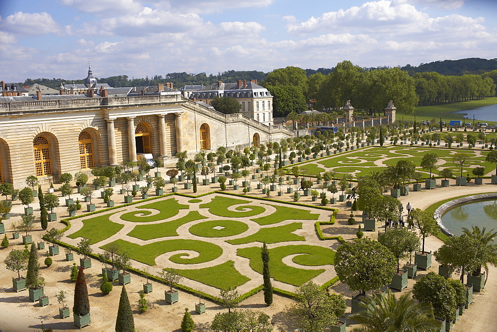 High angle view of a formal garden in front of a palace, Palace of Versailles, Versailles, France