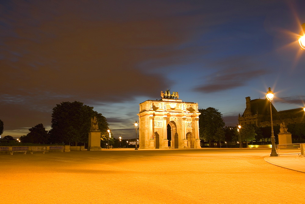 Triumphal arch lit up at night, Jardin De Tuileries, Paris, France