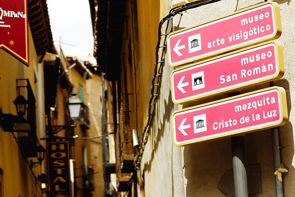 Directional signboards on a pole, Toledo, Spain