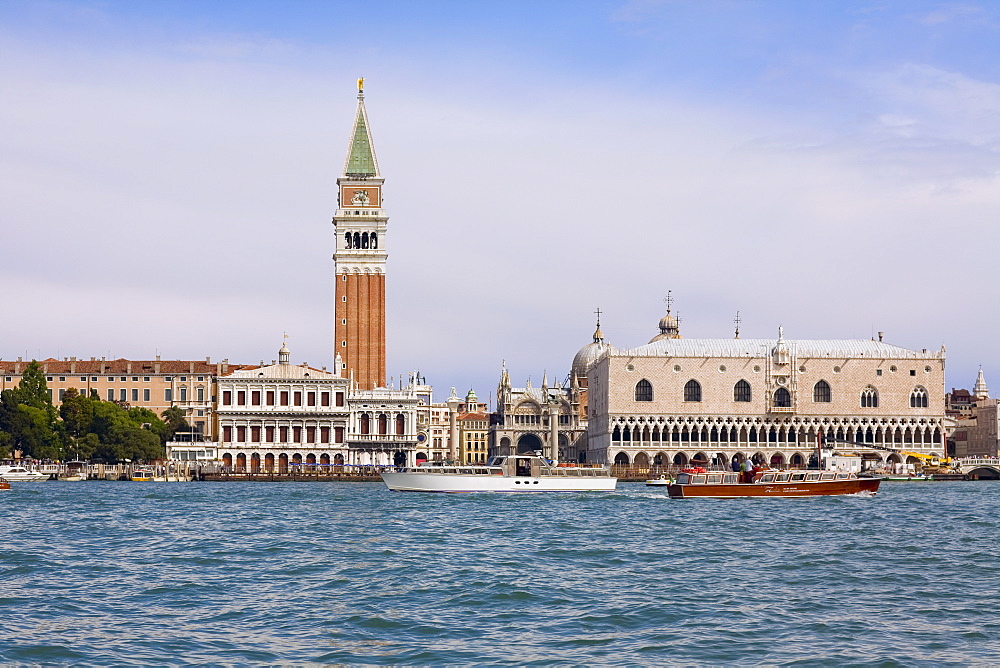 Boat docked near a tower, Bell Tower, St. Mark's Square, Venice, Italy