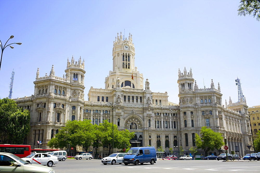 Traffic in front of a government building, Palacio De Comunicaciones, Plaza de Cibeles, Madrid, Spain