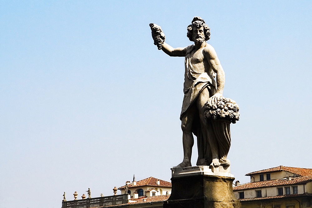 Low angle view of a statue, Ponte Santa Trinita Bridge, Florence, Tuscany, Italy