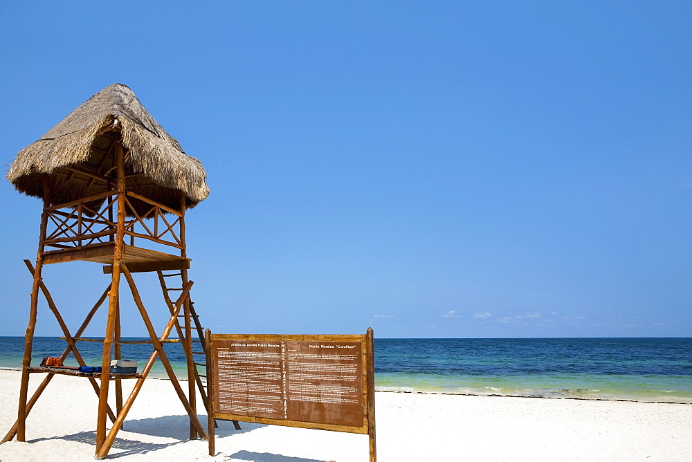 Lifeguard hut and an information board on the beach, Cancun, Mexico