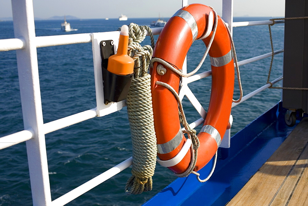 Life belt tied on the railing of a boat, Athens, Greece