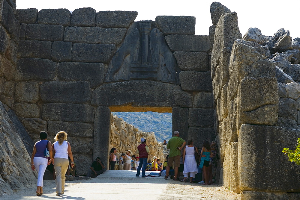 Tourists at an old ruin, Lion Gate, Mycenae, Peloponnese, Athens, Greece