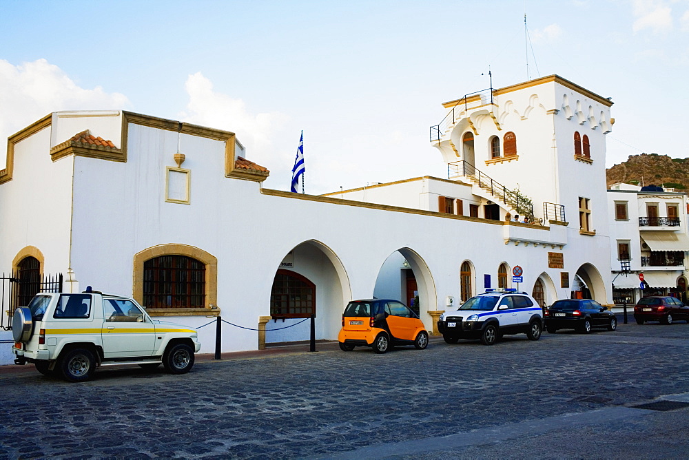 Cars parked in front of a building, Patmos, Dodecanese Islands, Greece