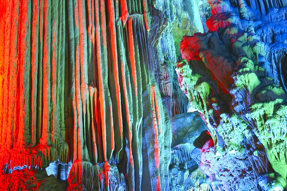 Stalactites and stalagmites in a cave, Seven Star Cave, Guilin, China