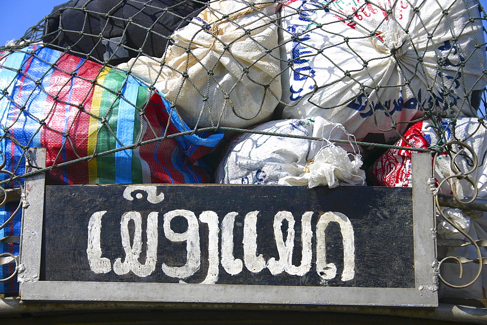 Close-up of bags loaded on top of a land vehicle, Vang Vieng, Laos