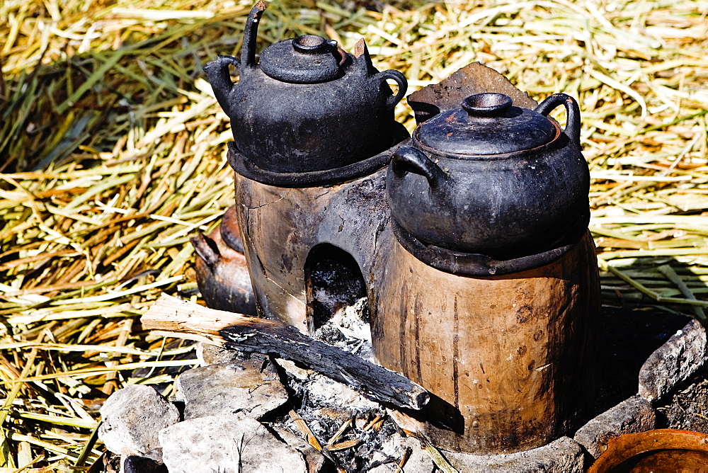 Close-up of two kettles on a oven, Uros Floating Islands, Puno, Peru