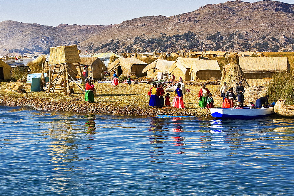 Group of people in a village, Lake Titicaca, Uros Floating Islands, Puno, Peru