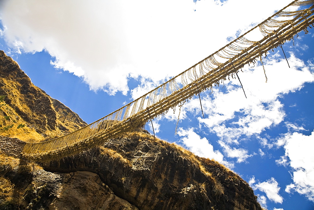 Low angle view of a rope bridge across a mountain, Queswachaca, Peru