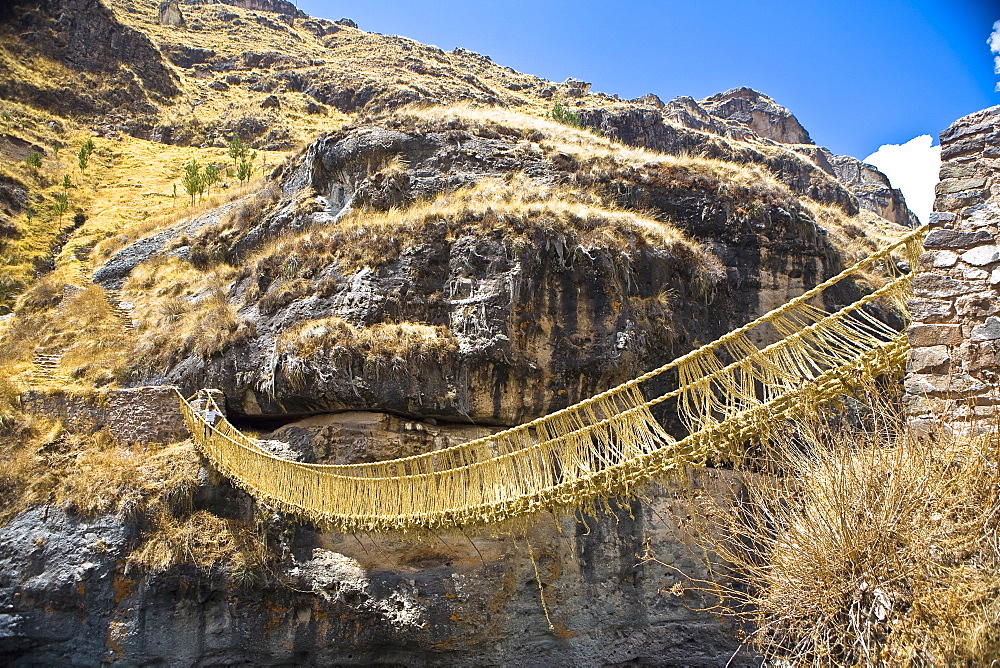 Low angle view of a rope bridge across a mountain, Queswachaca, Peru