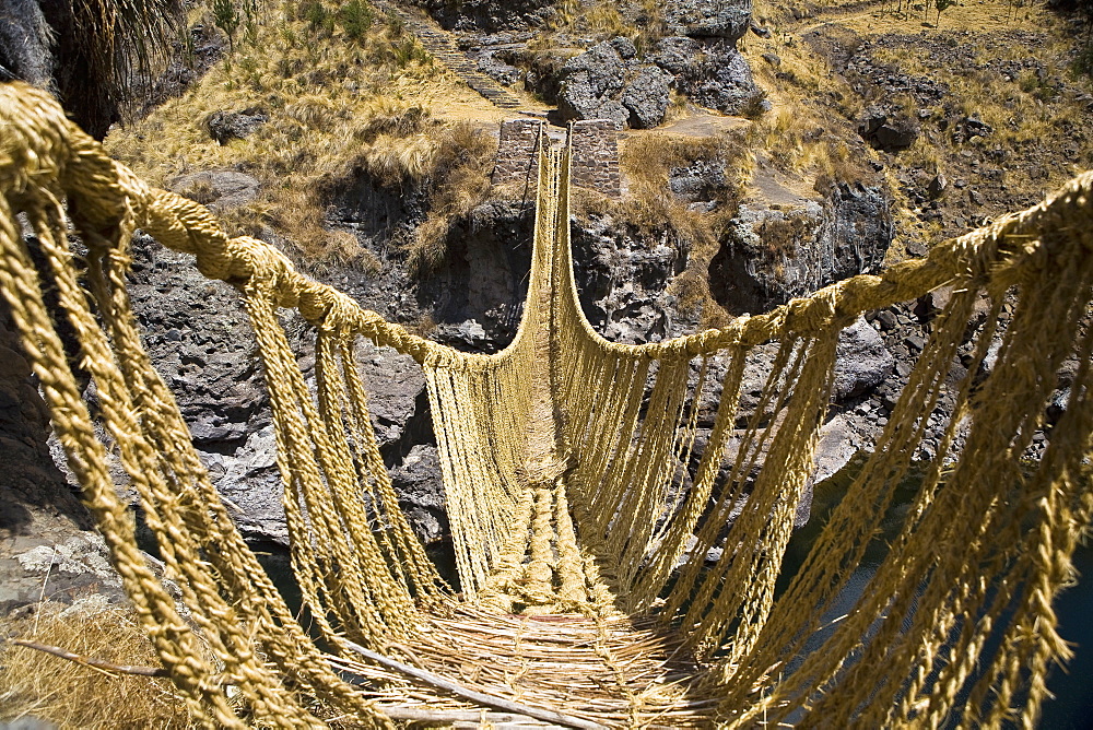 Rope bridge across a mountain, Queswachaca, Peru