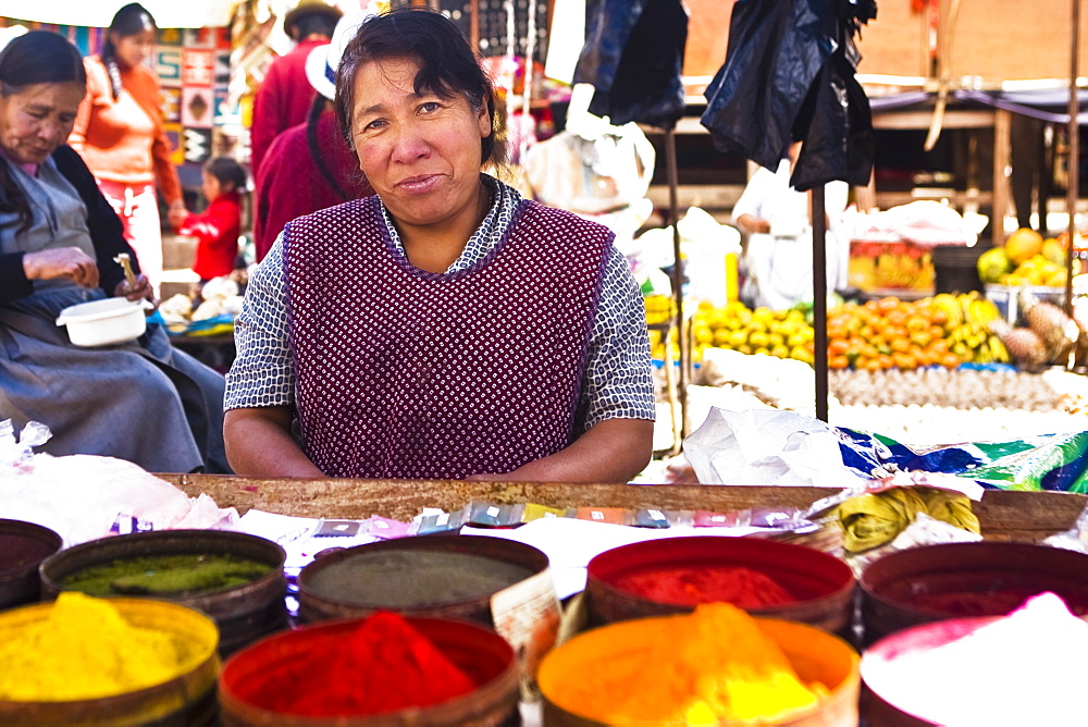 Portrait of a mature woman standing at a market stall, Peru