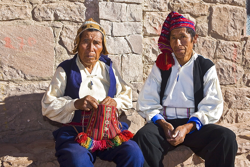 Portrait of two senior men sitting together, Taquile Island, Lake Titicaca, Puno, Peru