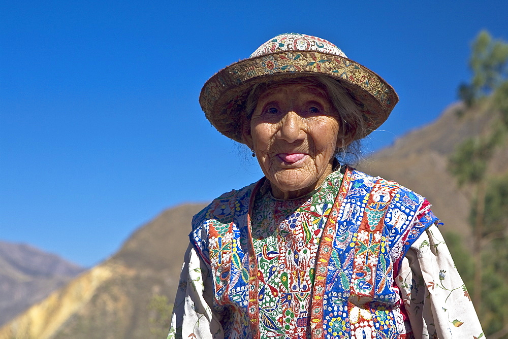 Portrait of a senior woman sticking her tongue out, Coshnirua, Peru