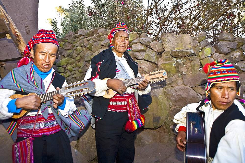 Three guitarists performing, Lake Titicaca, Taquile Island, Puno, Peru