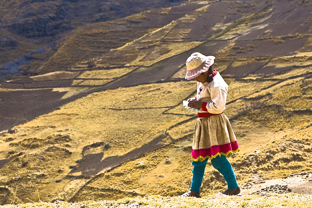 Side profile of a girl walking on a hill, Peru