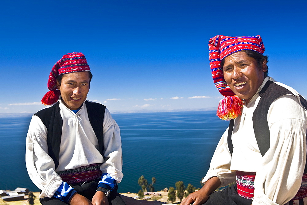 Portrait of two young men sitting, Taquile Island, Lake Titicaca, Puno, Peru