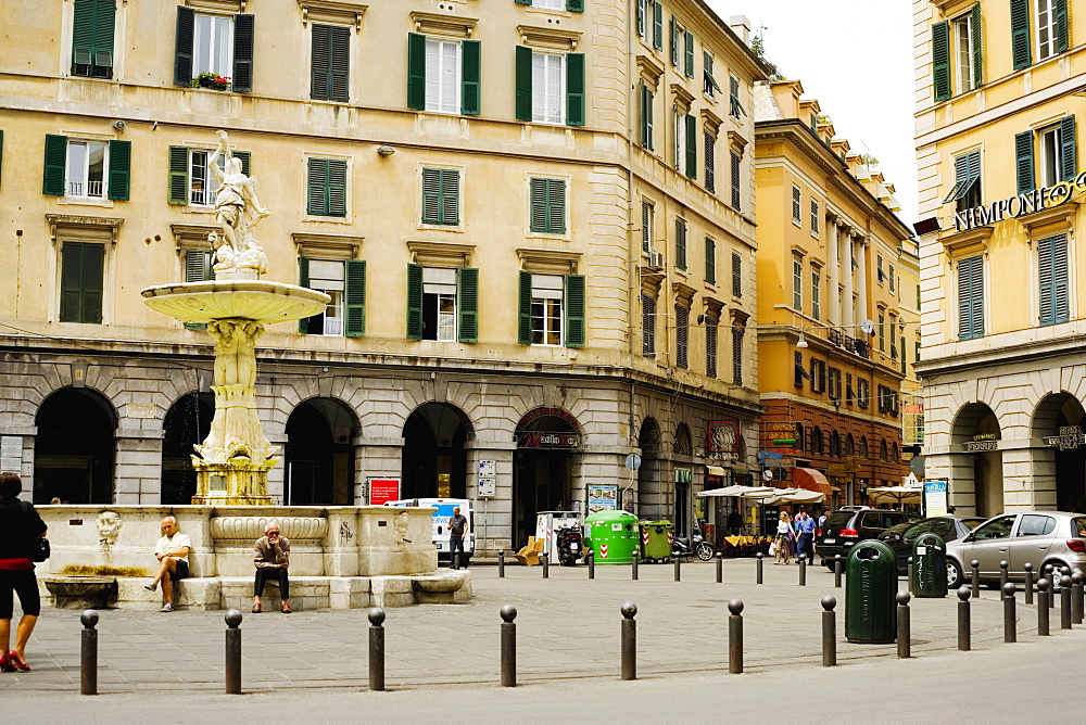 Fountain in front of buildings, Piazza Colombo, Genoa, Liguria, Italy